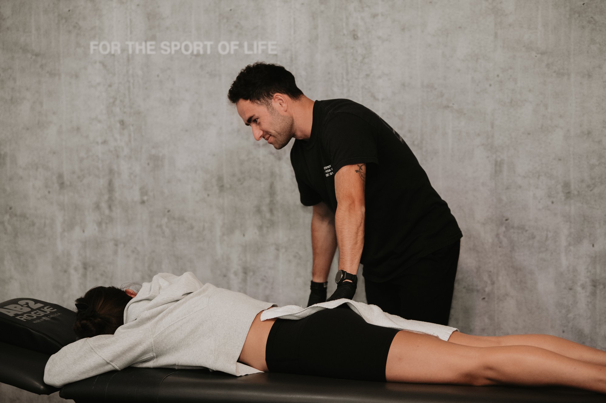 Doctor of Physical Therapy performing manual therapy on athlete at MOTIVNY clinic in SoHo, New York Doctor of Physical Therapy performing manual therapy on athlete at MOTIVNY clinic in SoHo, New York