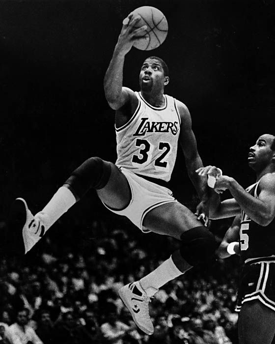 Magic Johnson playing basketball for LA Lakers