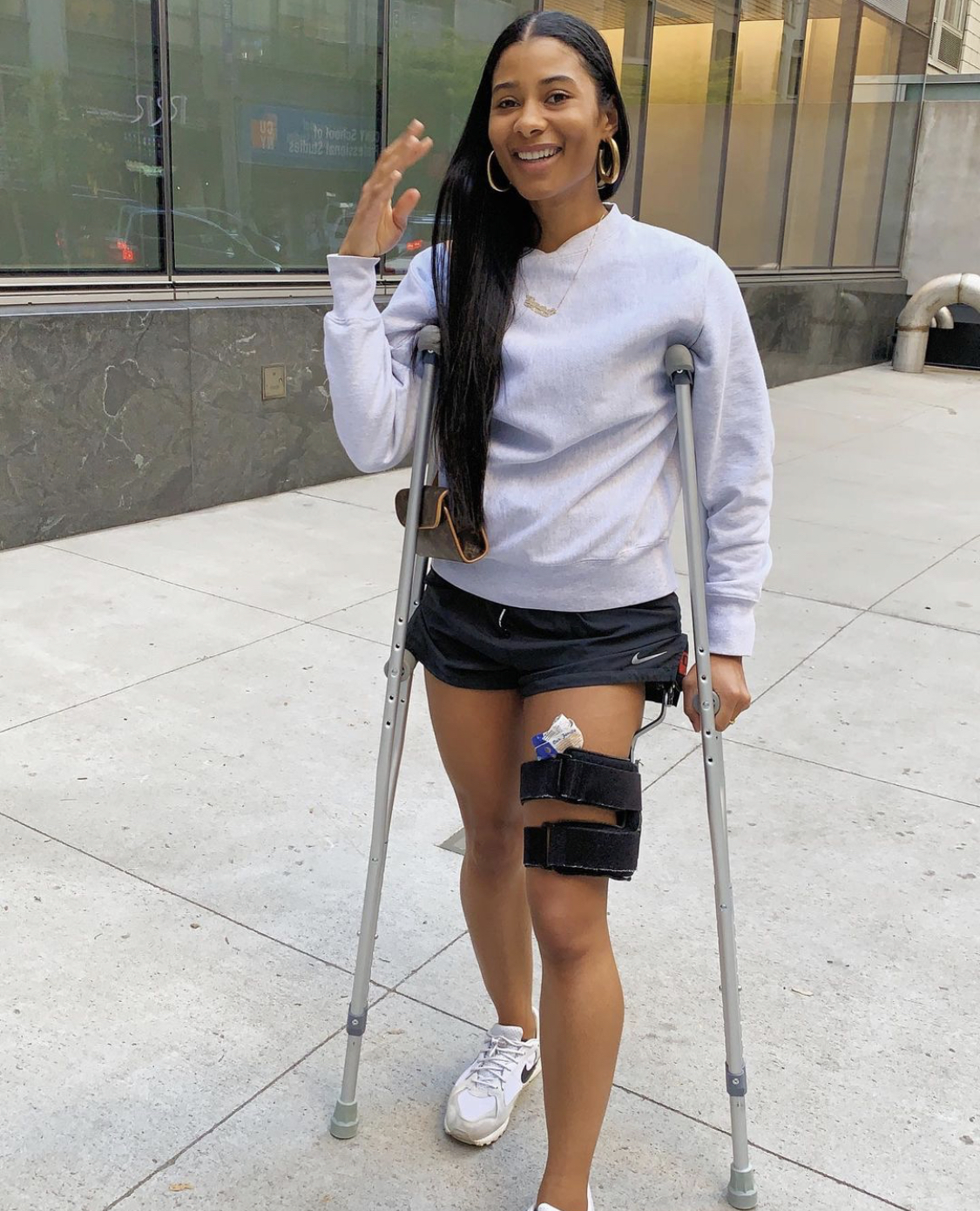 Tamara Pridgett standing with crutches