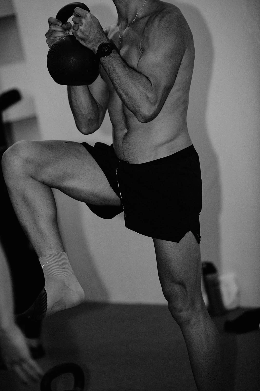 Dr. Meredith Mottern demonstrating heavy goblet kettlebell single-leg march for running hip stability